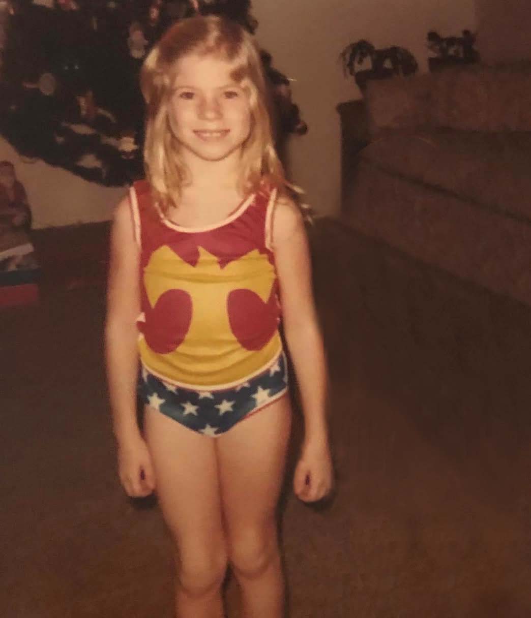 Photo of Hilary as a child in a wonder woman costume